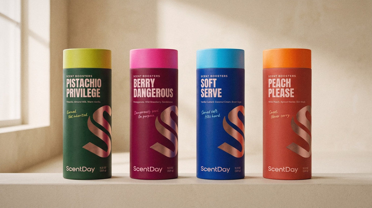 The ScentDay scent booster range on a sunlit windowsill — Pistachio Privilege, Berry Dangerous, Soft Serve and Peach Please