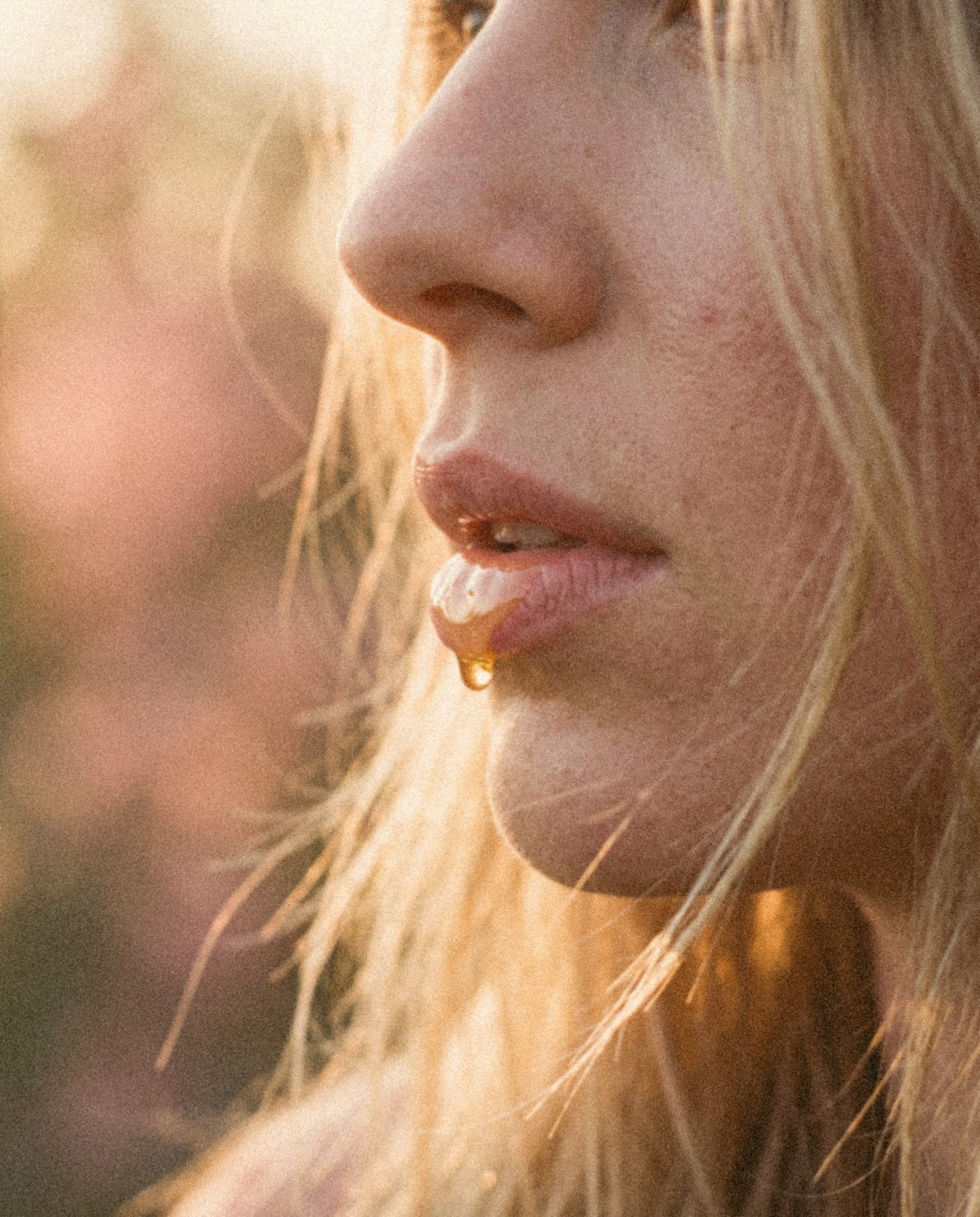 Honey on her lips in the low sun